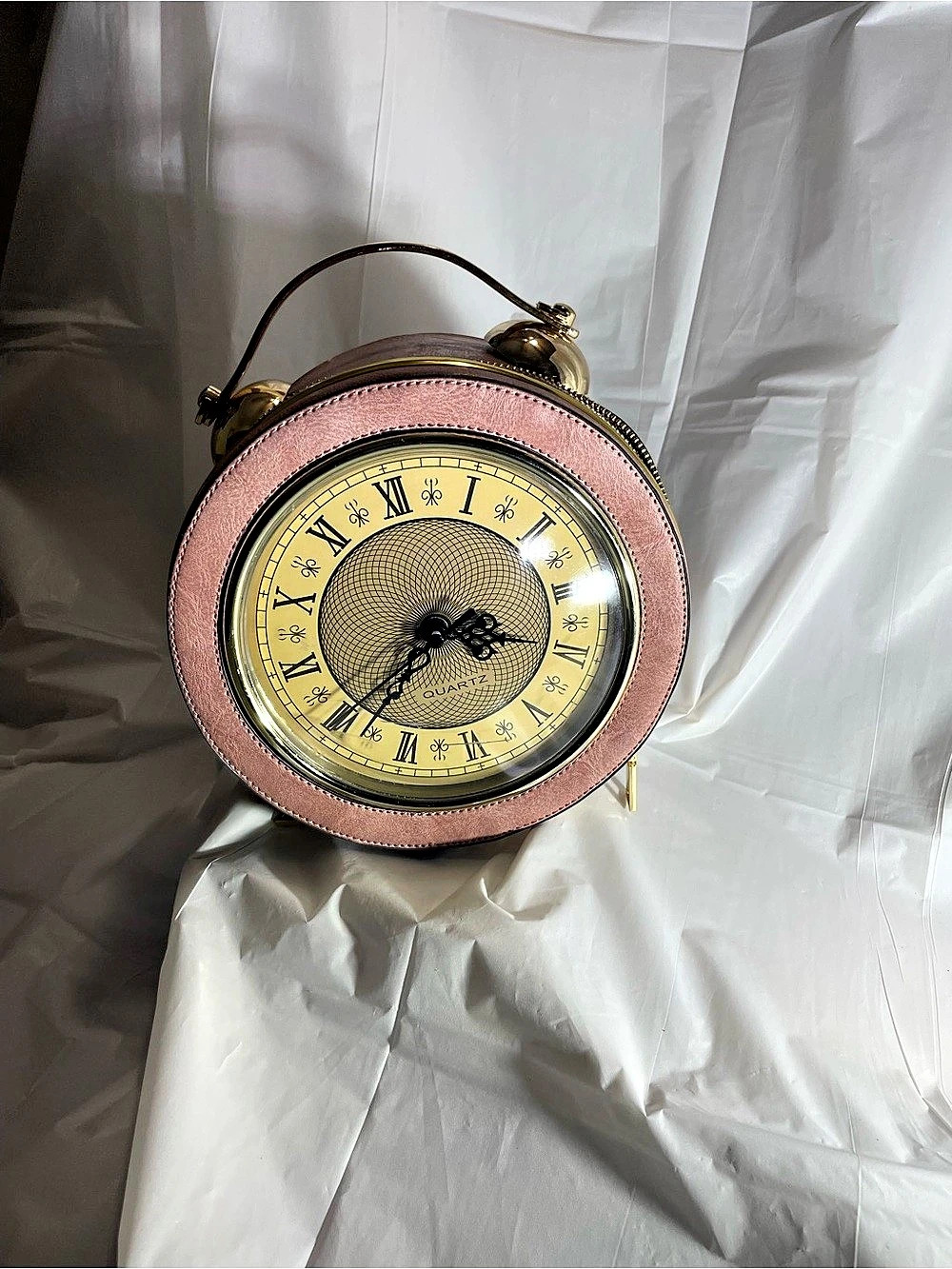 Round Clock Face Mini Bag in Pink & Gold with scratches on glass
